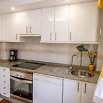 Acogedor En مينيو